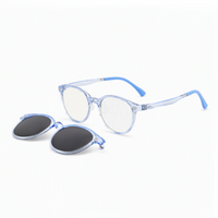 Transparent blue eyeglasses with black oval lenses, plus an extra lens cover