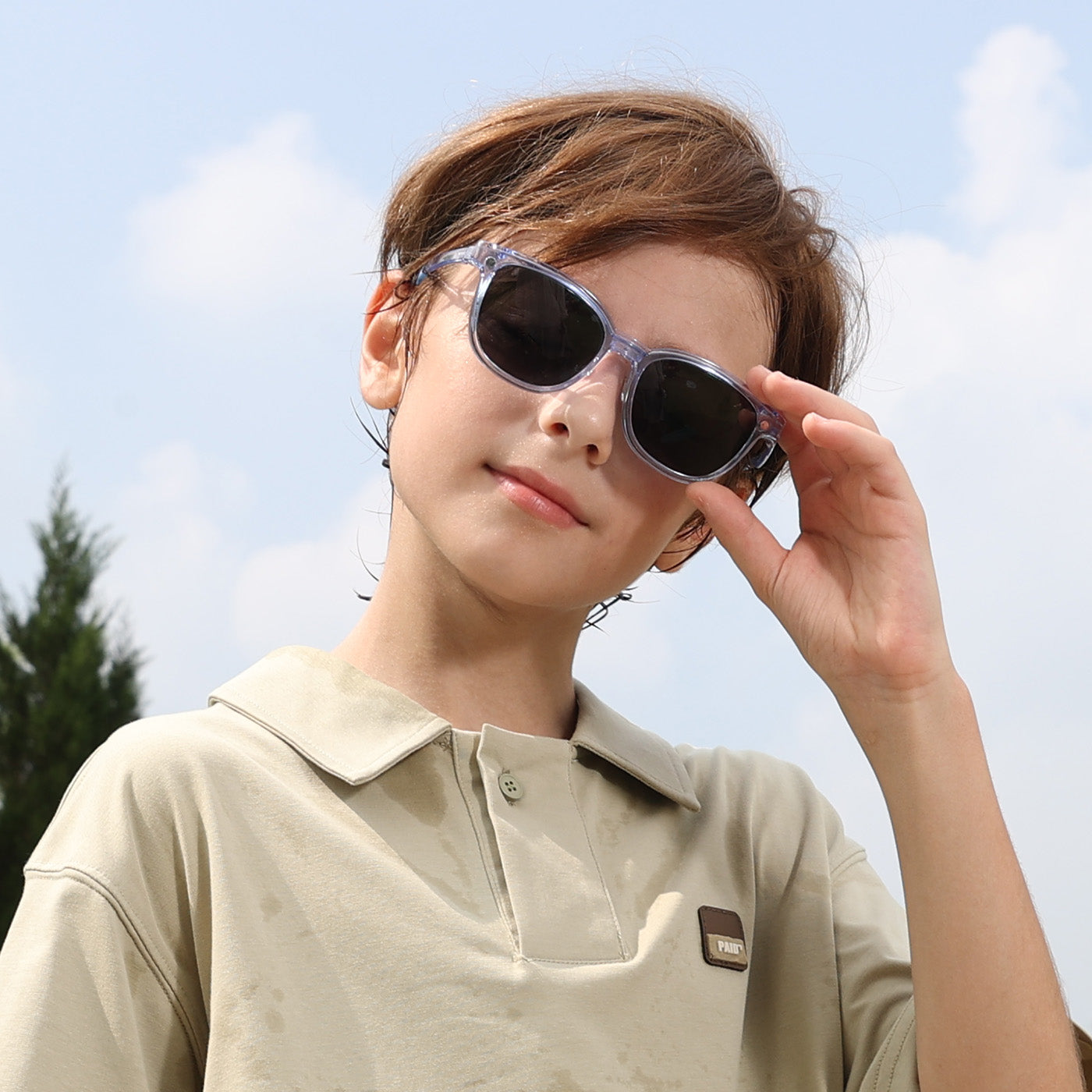 2-in-1 eyewear sunglasses with transparent blue frame and dark lenses, side view