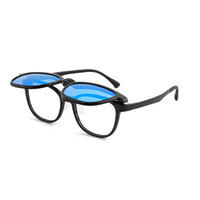 Black 2-in-1 glasses with blue-tinted lenses in rounded frames