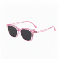 2-in-1 pink translucent eyeglasses with black tinted lenses and side hinge detail