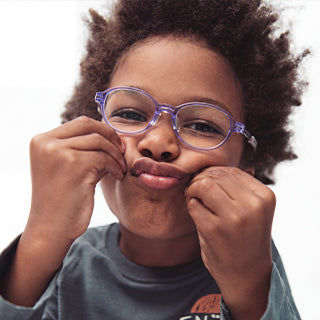 Two children wearing EyeBuddy glasses