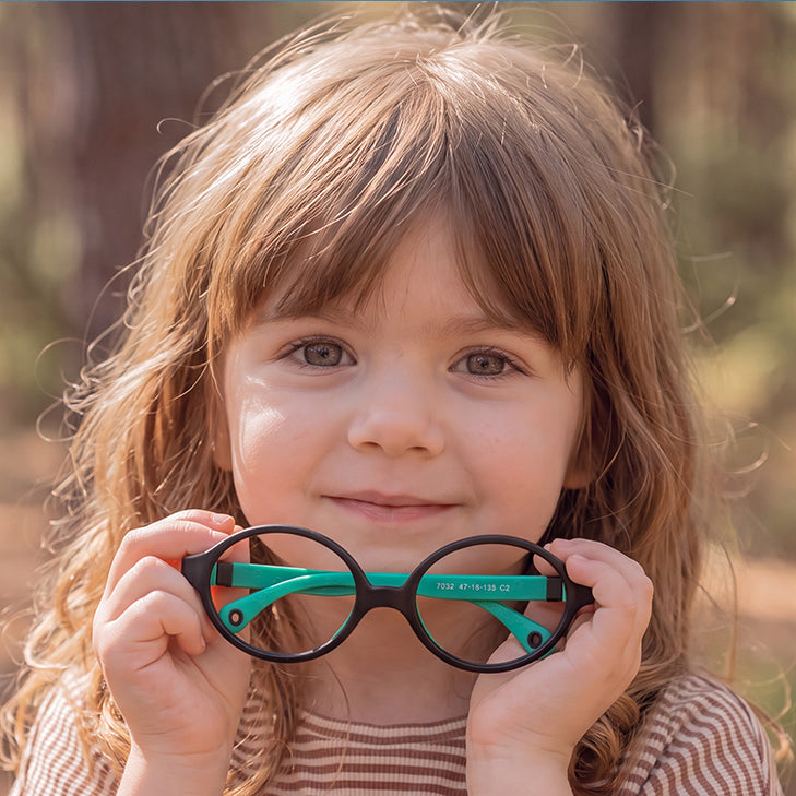 Two children wearing EyeBuddy glasses