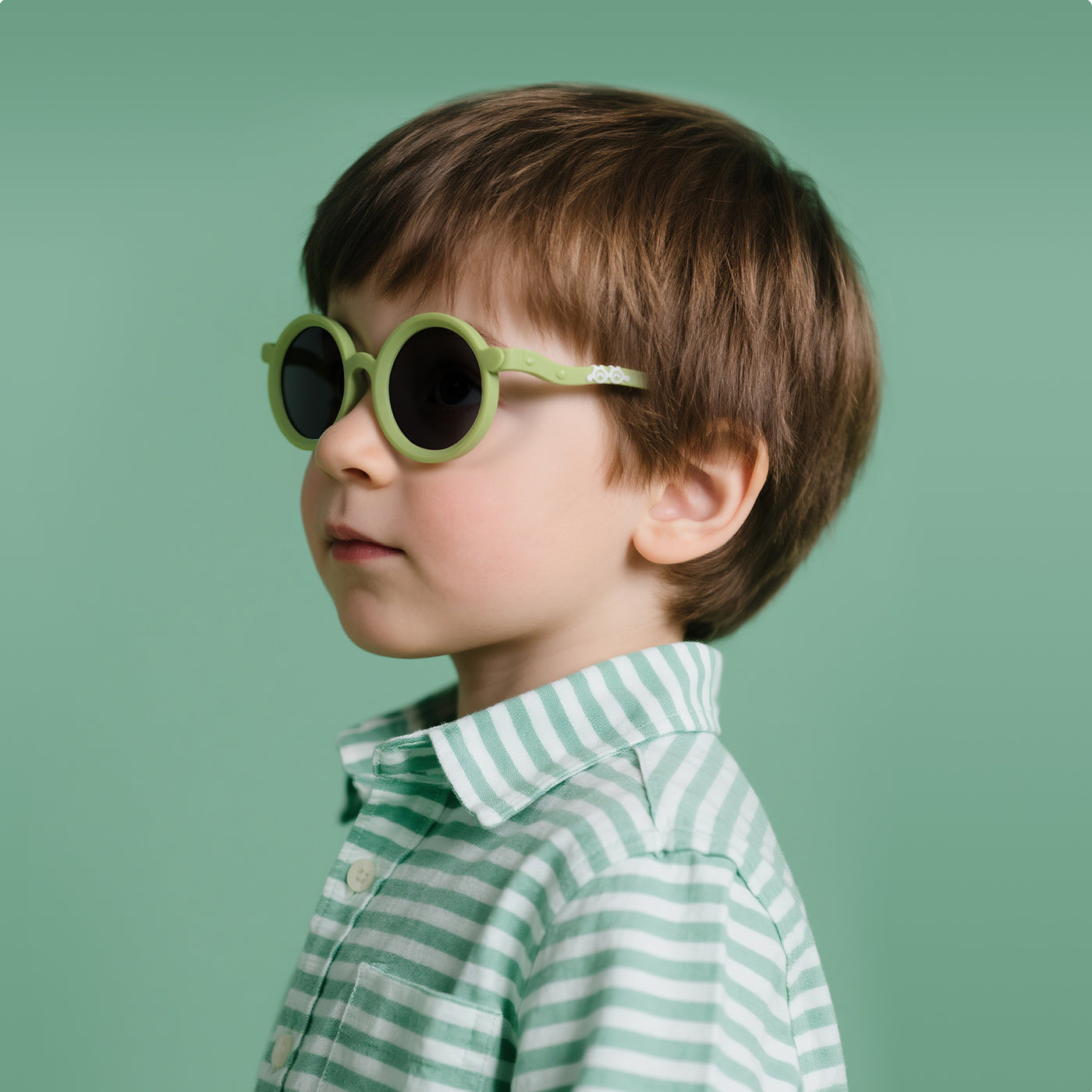 Zest kids sunglasses in Green, worn by a child
