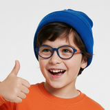 Child wearing an orange sweatshirt, blue beanie, and glasses giving a thumbs-up on a white background