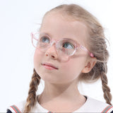 Young girl wearing a navy blue uniform with a white collar on a white background