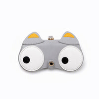 Clip-on pouch in gray with white eye patches, orange accents, and gold snap
