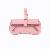 Pink clip-on pouch with front pocket and metal bar, attached to a pink strap