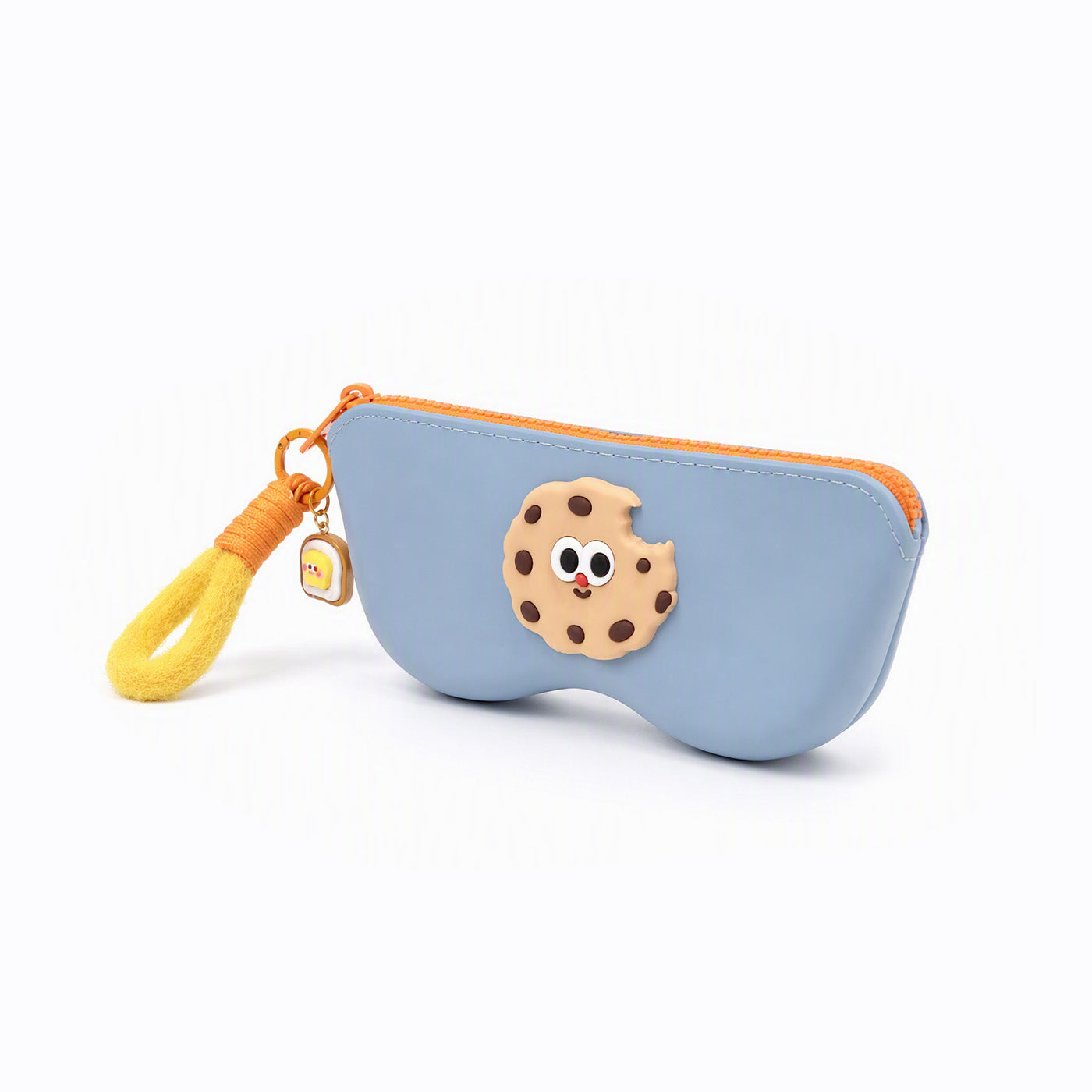 Blue pencil case with orange zipper and cookie-face patch; hanging yellow tassel charm