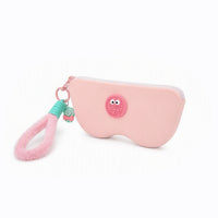 Pink pencil case with light pink zipper and owl-style patch; pink-and-green tassel charm