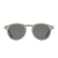 Puddle oval sunglasses with light beige frame and dark lenses