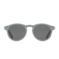 Sunglasses with light mint frames and dark tinted oval lenses