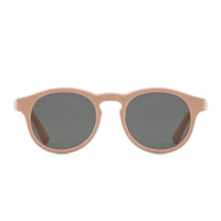 Beige kids sunglasses front view with dark lenses and rounded oval frames