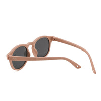 Round sunglasses with light brown frame and dark lenses, angled view