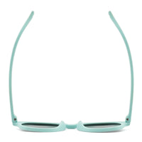Light green kids sunglasses front view with dark lenses and flexible bridge