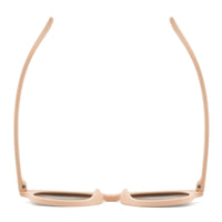 Beige kids sunglasses back view with dark lower lenses and flexible bridge