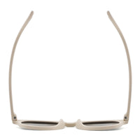 Oval sunglasses with light beige frame and dark lenses, front view