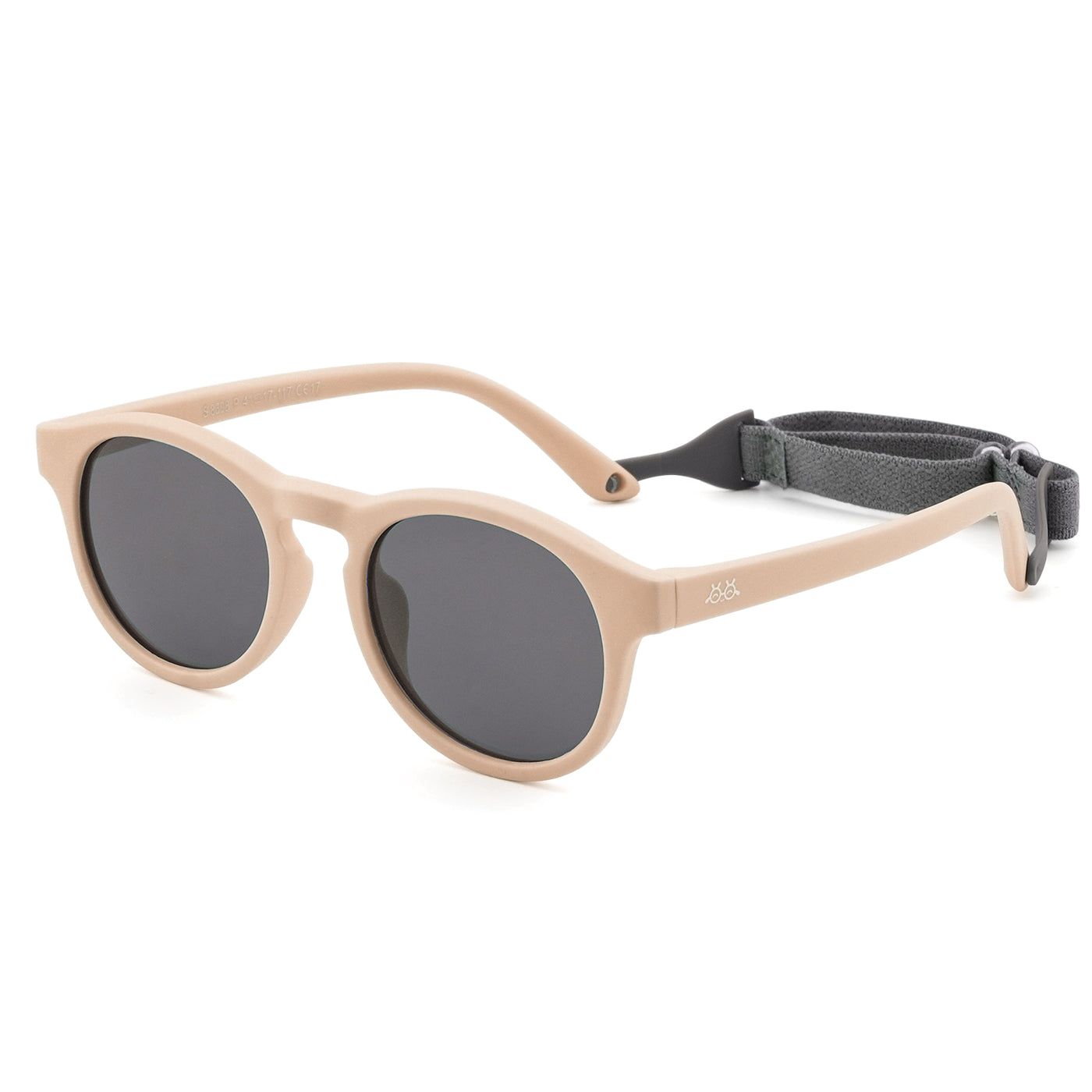 Beige kids sunglasses with dark lenses, rounded oval frames, and fabric strap