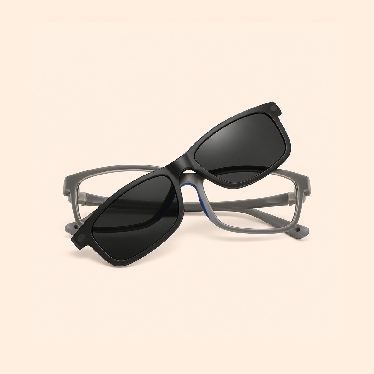 Grey eyeglass frames with black clip-on sunglasses, tinted lenses