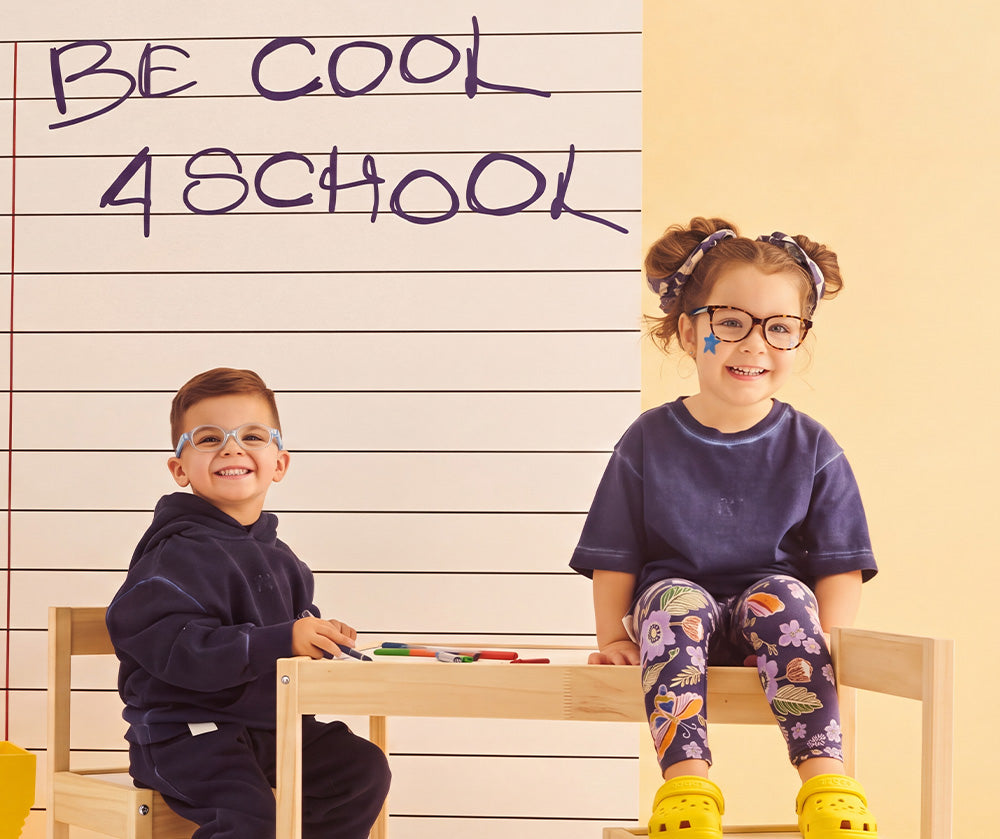 Two children wearing EyeBuddy glasses