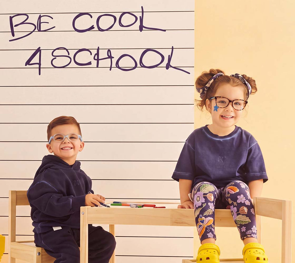Two children wearing EyeBuddy glasses