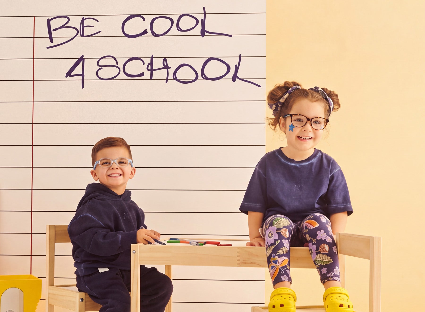 Two children wearing EyeBuddy glasses