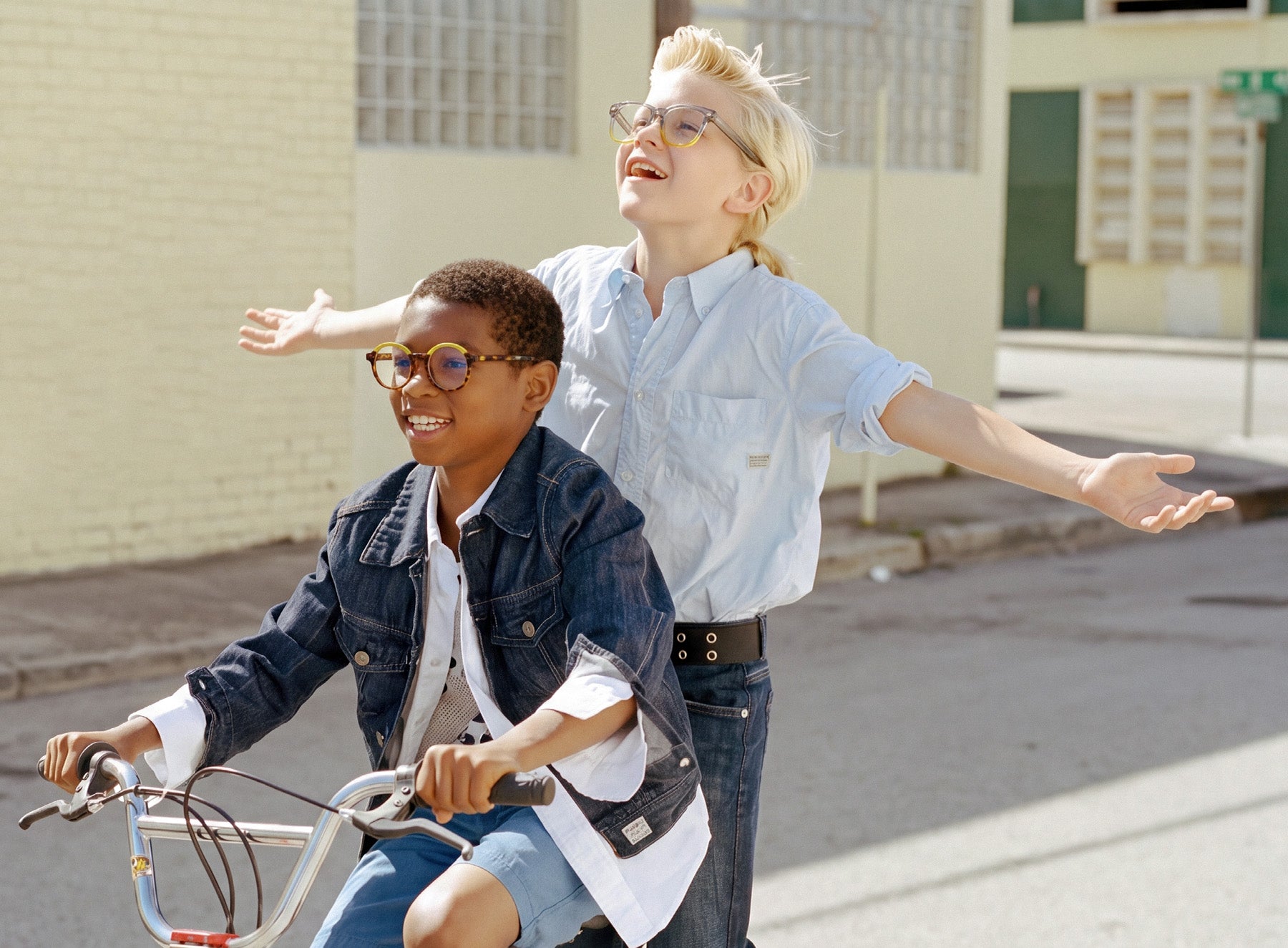 Two children wearing EyeBuddy glasses