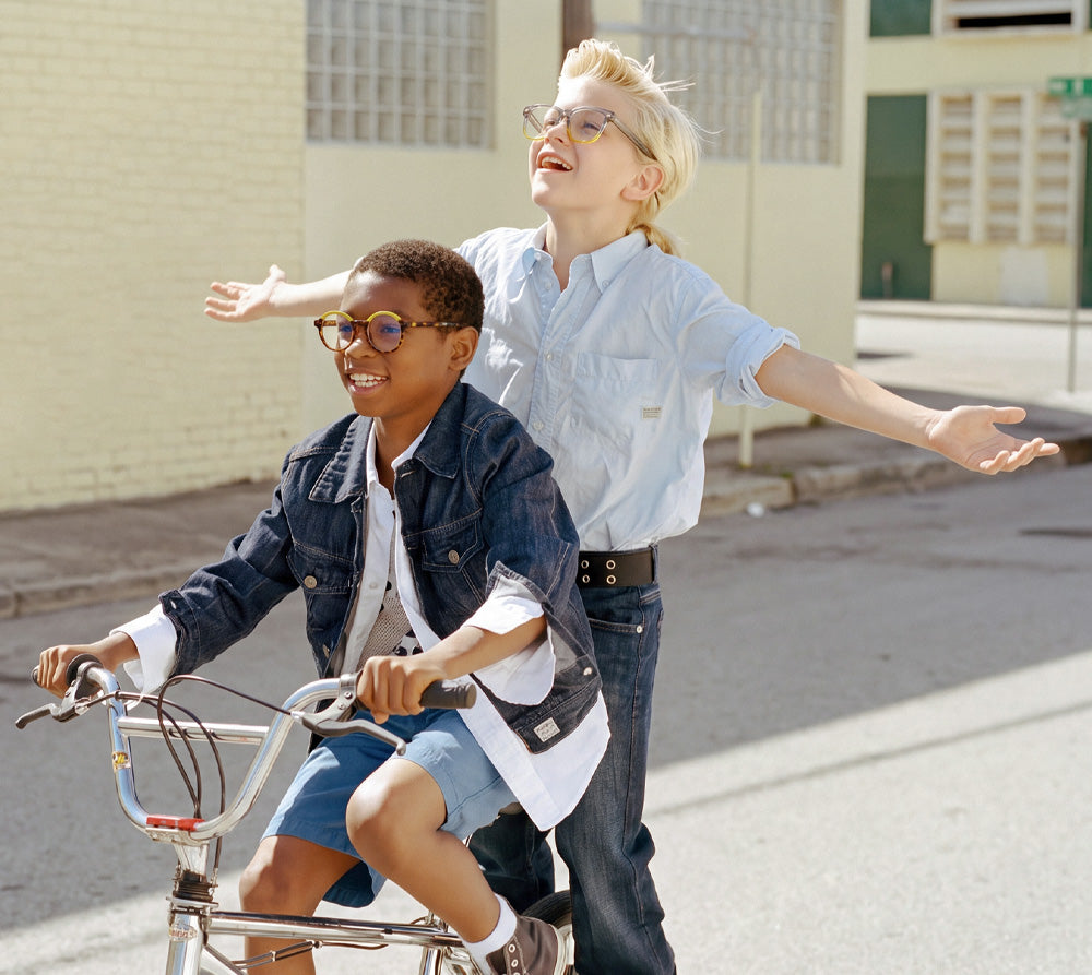 Two children wearing EyeBuddy glasses