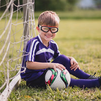 Kids purple soccer jersey with white stripes, short sleeves, worn with goggles