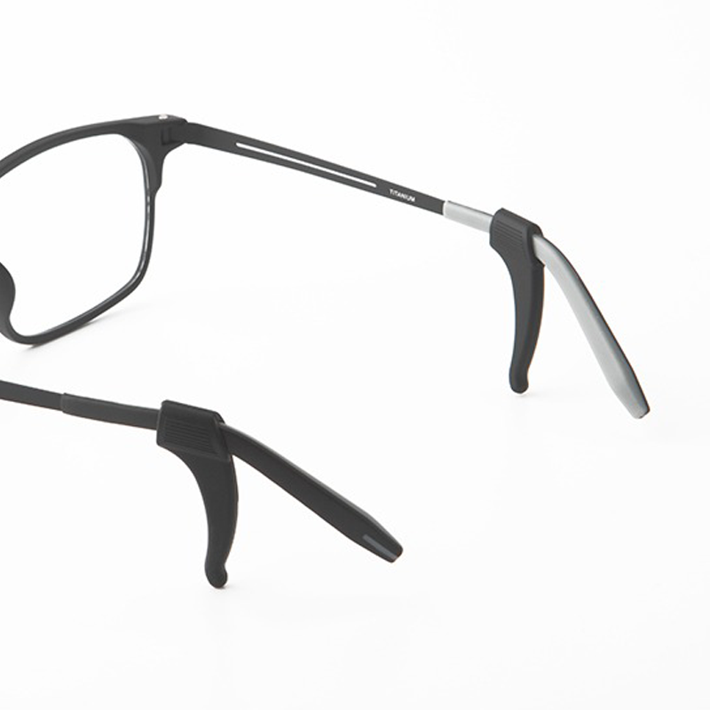 Black anti-slip glasses ear hooks attached to eyeglass frame ends