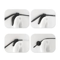 Black anti-slip ear hook pads installed on glasses temple, close-up