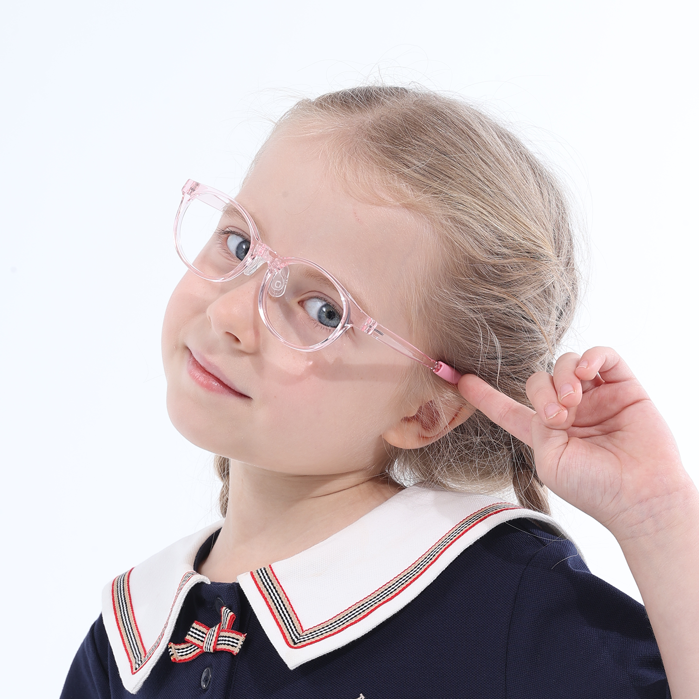 Clear purple rounded eyeglasses with bow detail at temple, worn with navy sailor collar