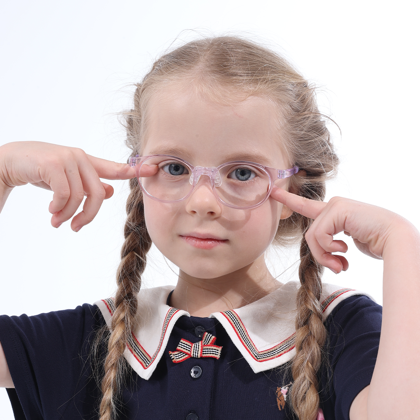 Clear purple rounded eyeglasses with bow detail, paired with navy sailor dress and striped collar