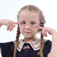 Clear purple rounded eyeglasses with bow detail, paired with navy sailor dress and striped collar